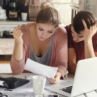 Couple working out household debt