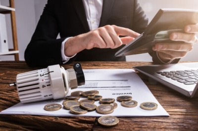 Businessperson Calculating Energy Bills