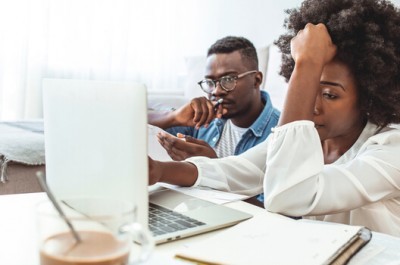 Couple Getting Debt Advice Laptop