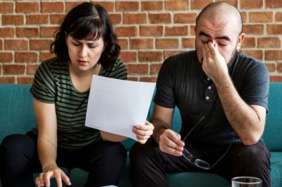 Couple Struggling With Lots Of Debts