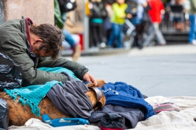 Homeless Man Sitting On The Floor