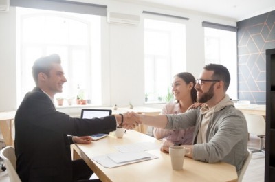 Man And Woman Having A Meeting With Finanical Advisor