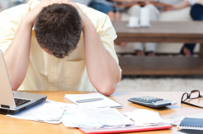 Man Calculating His Debts