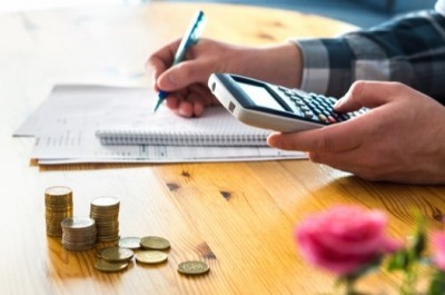 Man Calculating Income