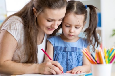 Mother And Daughter Drawing together