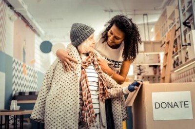 Poverty Campaigner Helping A Poor Woman