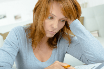 Stressed Lady Using Calculator