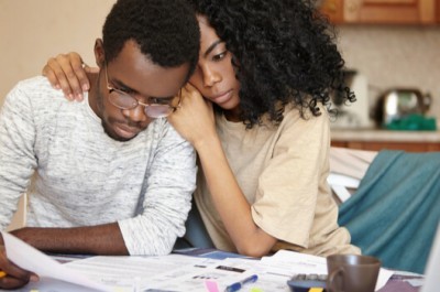 Unhappy Couple With Bills