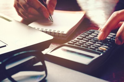 Woman Calculating Loans