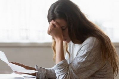Distressed woman with her bills