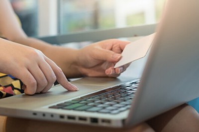 Woman On Laptop With Credit Card