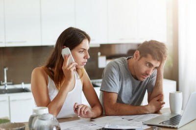 Woman Phoning For Debt Help