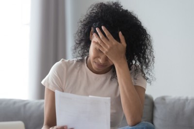 Woman Reading Eviction Notice