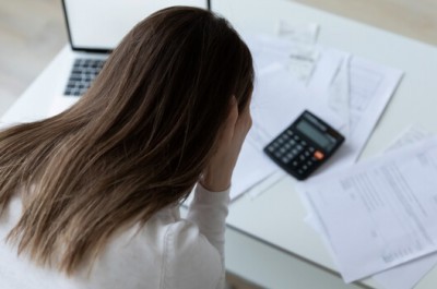 Young Woman With Debts