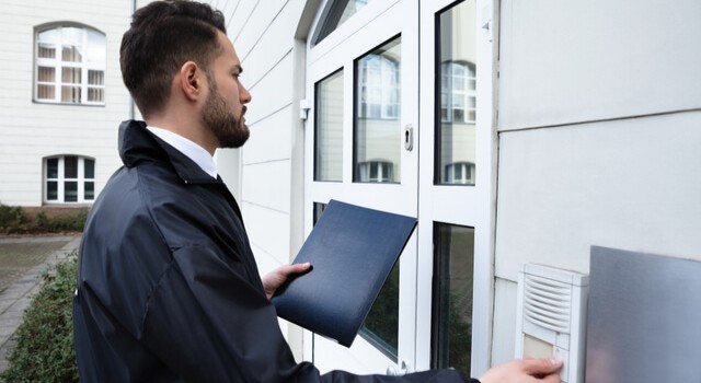 Bailiff At The Entrance To A House