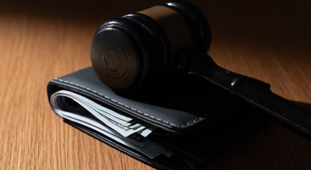 Gavel on top of wallet