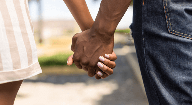 Couple holding hands