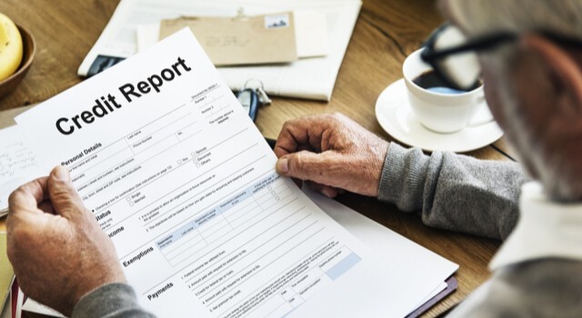 Elderly Man Checking Credit Report