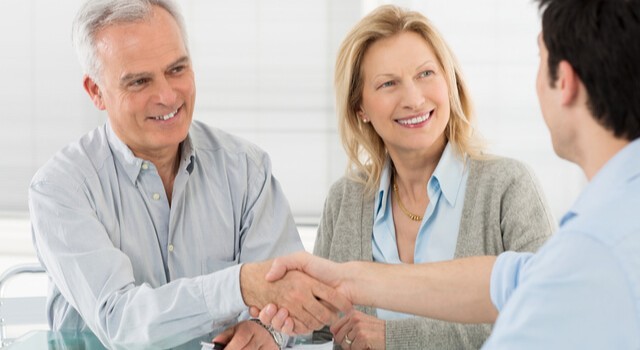 Happy Couple Shaking Hands Advisor