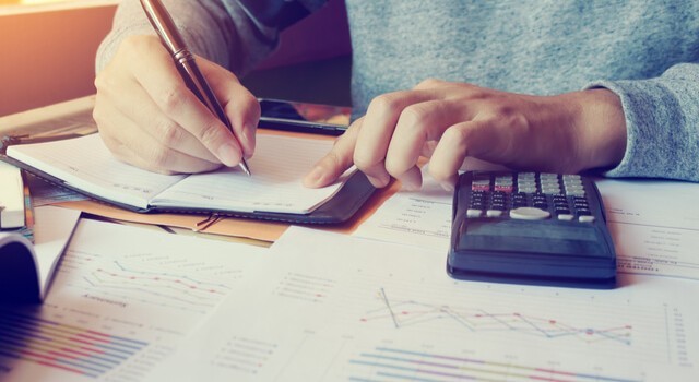 Man Calculating Living Expenses