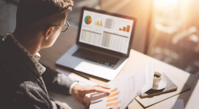 Businessman looking at finances on the laptop