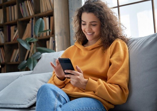 Woman smiling on her phone