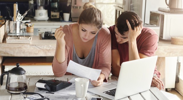 Couple working out household debt