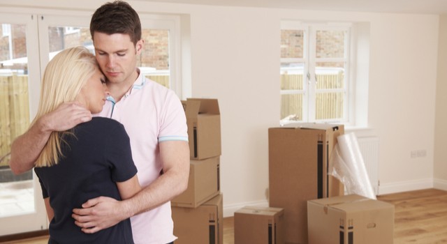 Sad couple with their house being repossessed