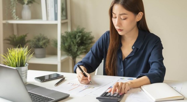 Woman doing company debts analysis