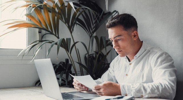 Man looking at a Statutory Demand request